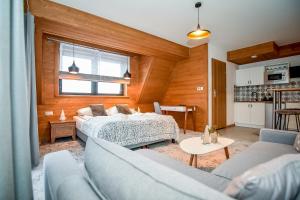 Kuchyňa alebo kuchynka v ubytovaní Apartamenty Pod Tatrzańskim Niebem
