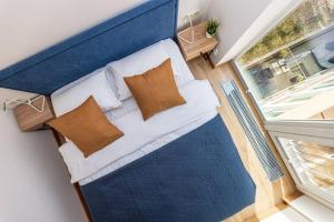 Ένα ή περισσότερα κρεβάτια σε δωμάτιο στο Sea & Sky Residence, City Centre