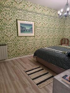 a bedroom with a bed and a picture on the wall at Eden rock apartment in Grimaldi +29 photos