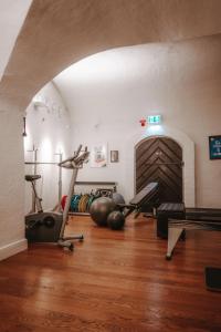 a room with a gym with exercise equipment on the floor at Hotel Kungsträdgården in Stockholm