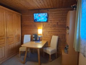 TV a/nebo společenská místnost v ubytování Haus Fichtenblick