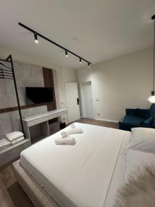 Postel nebo postele na pokoji v ubytování Alcazar Luxury Suites