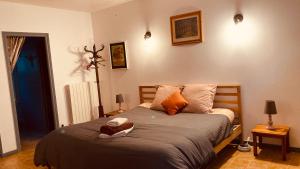 a bedroom with a bed with two towels on it at Métairie de Moutiques in Cazaubon +51 photos