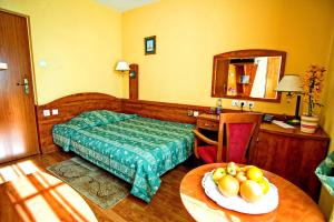 Hotel Pietrak客房内的一张或多张床位