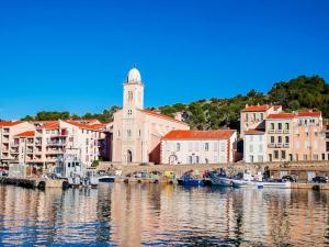 a group of boats in the water near a city at CANIGOU in Port-Vendres