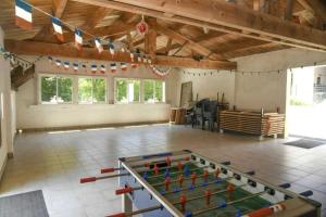 a large room with a ping pong table in it at Camping 3 étoiles - Piscine - cca0gbb in Apremont