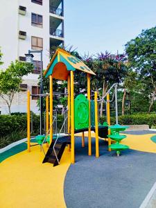 a playground with a slide and a play structure at Tagaytay Staycation - Kasa Luntian in Tagaytay