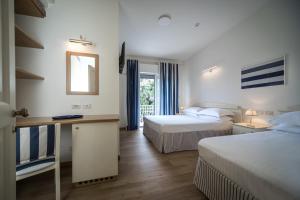 Voodi või voodid majutusasutuse Murè Hotel Numana toas