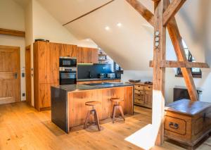 Kuchyň nebo kuchyňský kout v ubytování Apartmán Delux - Pihel