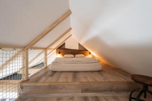 Apartmán Bellaにあるベッド