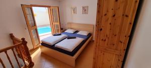 En eller flere senge i et værelse på Private house Tauro 10 - Simunek + 40 billeder