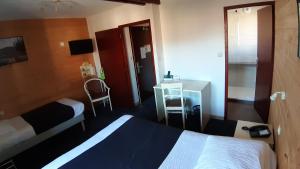 Postel nebo postele na pokoji v ubytování Hotel De La Route Verte