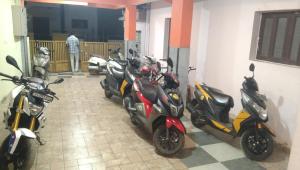 a group of motorcycles parked in a room at Banashree Guest inn in Chikmagalūr