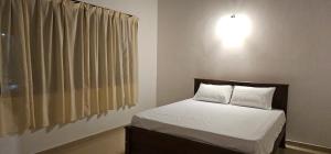 Letto o letti in una camera di VThree Family House