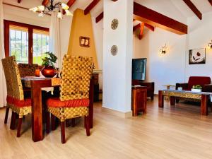a living room with a table and chairs at Casa Laura by Sun & Sea Homes in Moraira