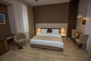 Postel nebo postele na pokoji v ubytování History Hotel Tbilisi