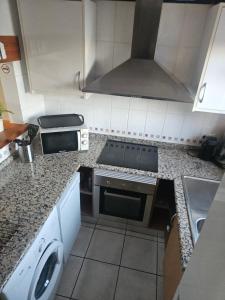 Kuchyň nebo kuchyňský kout v ubytování La Casita de la Playa 24-38