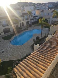 Bazén v ubytování La Casita de la Playa 24-38 nebo v jeho okolí