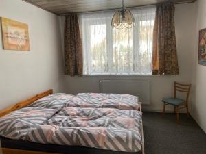 Postel nebo postele na pokoji v ubytování Apartmán Orlické hory