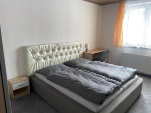 Postel nebo postele na pokoji v ubytování Apartmán Orlické hory