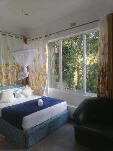 Postel nebo postele na pokoji v ubytování Summer villa Ambagolla