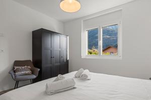 Ένα ή περισσότερα κρεβάτια σε δωμάτιο στο Appartement neuf entre plaine et montagnes