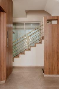 a hallway with a staircase in a house at Hemma Bogotá Chapinero Premium Suites Hotel in Bogotá
