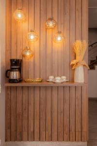 a kitchen with a counter with lights on it at Hemma Bogotá Chapinero Premium Suites Hotel in Bogotá