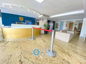 an office lobby with a counter and a bar at Gold Flat Cabo Branco By 123Quarto Hospedagem in Tambaú +197 photos