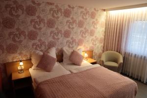 Postel nebo postele na pokoji v ubytování Hotel Hohe Wart