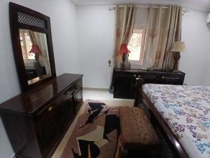 Ein Bett oder Betten in einem Zimmer der Unterkunft Appartement Villa Saran, Nongo