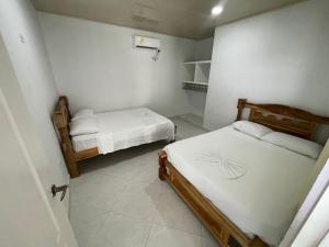 Giường trong phòng chung tại Apartments Tolú 3 habitaciones