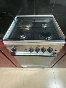 a stove top oven with black burners on it at Coastal Heaven in Bentota +30 photos