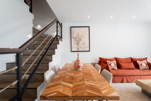 a living room with a table and a couch at Villa in Parque Santiago III in Playa de las Americas