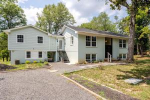 a white house with a driveway at Cozy 2BR1BA apt in SilverSpeing in Silver Spring