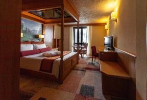 Postel nebo postele na pokoji v ubytování Hotel Intermonti