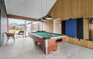 a pool table in the middle of a room at Gorgeous Home In Glesborg With Sauna in Glesborg