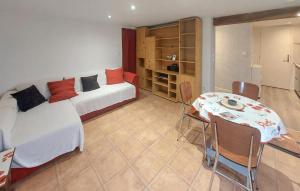 a room with two beds and a table and chairs at 1 Bedroom Amazing Home In Bléré in Bléré +10 photos