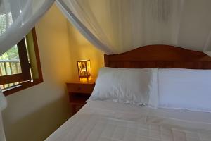 Postel nebo postele na pokoji v ubytování Licuri Praia de Algodões se hospedar na beira mar