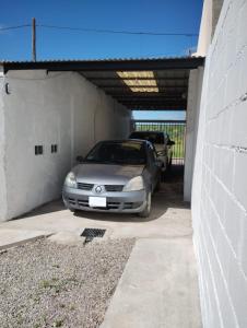 a car is parked in a garage at Casa Poetas in Villa Nueva