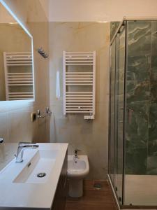 a bathroom with a sink and a shower and a toilet at Casa Belvedere - Centro Storico in Barletta