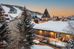 a lodge in the snow with a christmas tree at Lift House Lodge, Vail Lionshead Studio Condo, Walk to Gondola in Vail