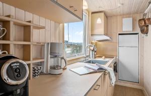 a small kitchen with a sink and a window at Gorgeous Home In Juelsminde With Wifi in Sønderby