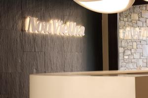 a sign that reads natalosa on a wall at Aparthotel Nou Vielha in Vielha