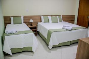 Postel nebo postele na pokoji v ubytování Domus Hotel Trindade - Canaã dos Carajás