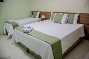 Postel nebo postele na pokoji v ubytování Domus Hotel Trindade - Canaã dos Carajás