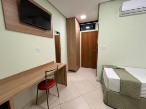 TV a/nebo společenská místnost v ubytování Domus Hotel Trindade - Canaã dos Carajás
