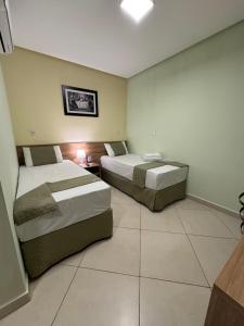 Postel nebo postele na pokoji v ubytování Domus Hotel Trindade - Canaã dos Carajás
