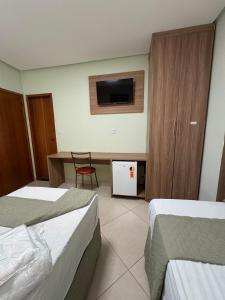 Postel nebo postele na pokoji v ubytování Domus Hotel Trindade - Canaã dos Carajás