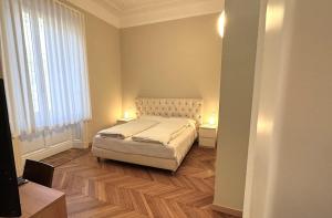 Postel nebo postele na pokoji v ubytování Hotel Palladio